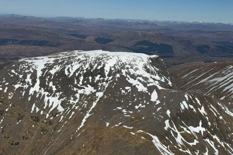 A snow-streaked mountain ridge